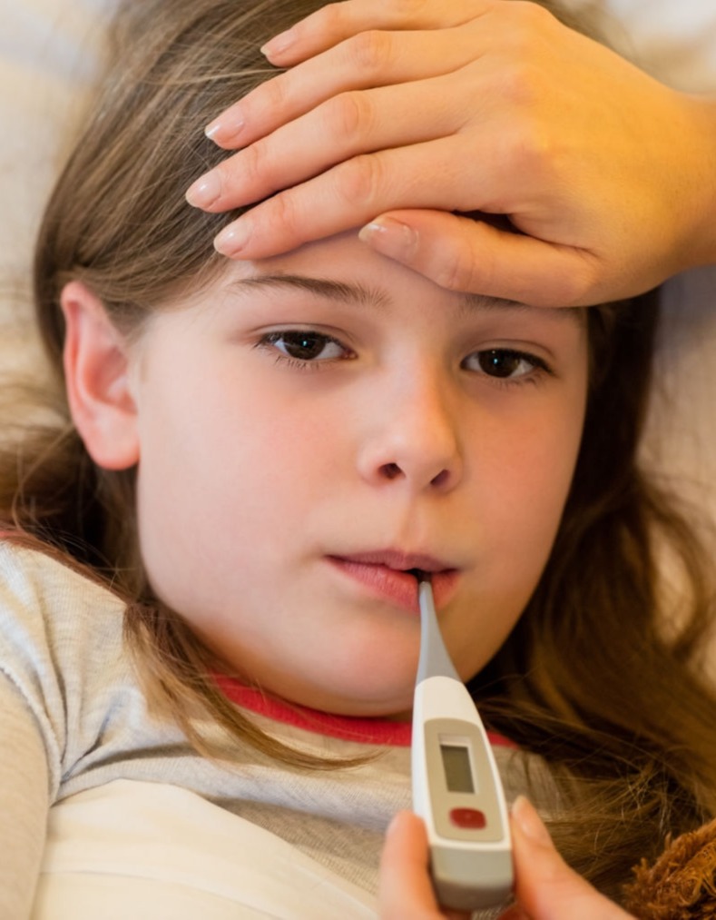 sick child with thermometer